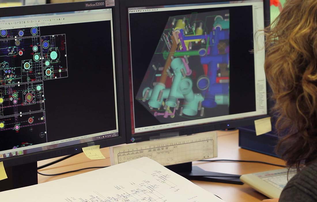 Engineer working with 3D programm for manifold blocks